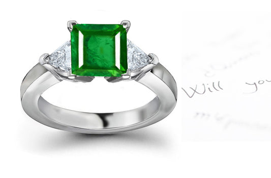 engagement ring with square emerald and trillion diamonds