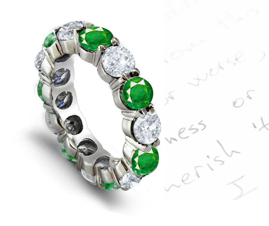eternity ring prong set with round emeralds and diamonds