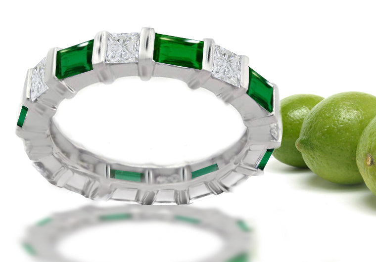 Stackable eternity ring with alternating baguette cut emeralds and square diamonds