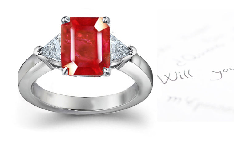 engagement ring three stone with emerald cut ruby center and side pear diamonds