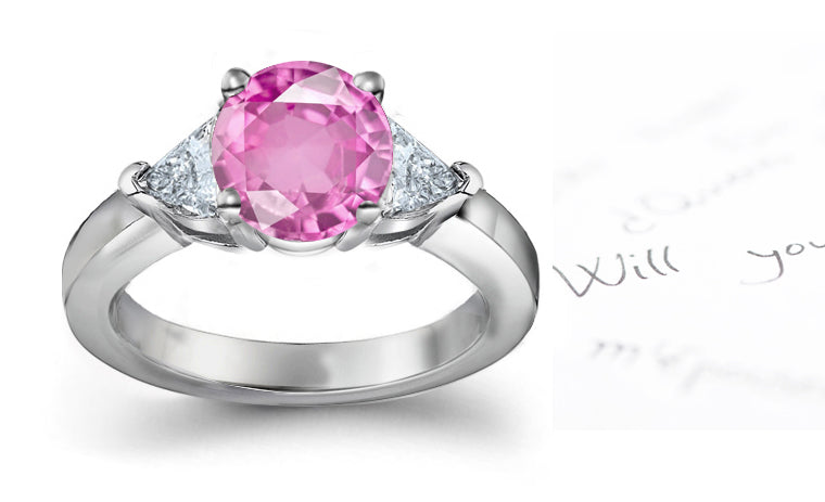 engagement ring three stone with oval pink sapphire center and side trillion diamonds