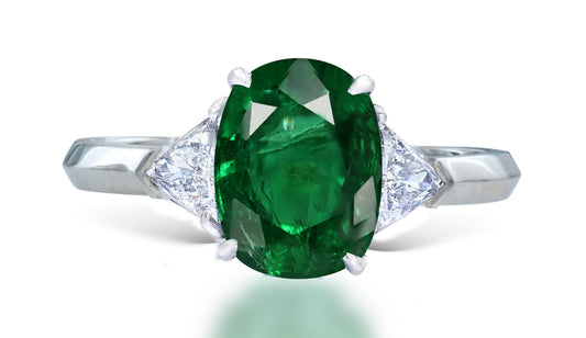 11 custom made unique oval emerald center stone with trillion diamond accents three stone engagement ring