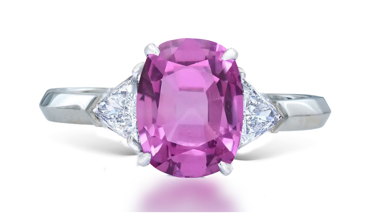 11 custom made unique oval pink sapphire center stone with trillion diamond accents three stone engagement ring