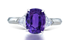 11 custom made unique oval purple sapphire center stone with trillion diamond accents three stone engagement ring