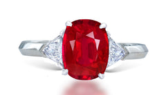 11 custom made unique oval ruby center stone with trillion diamond accents three stone engagement ring