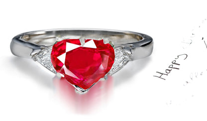 engagement ring three stone with heart ruby center and side trillion diamonds