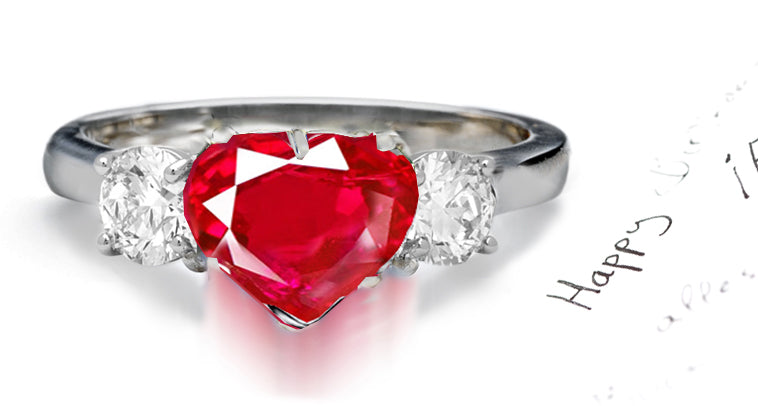 engagement ring three stone with heart ruby center and side round diamonds