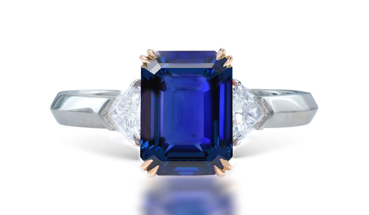 12 custom made unique emerald cut blue sapphire center stone with trillion diamond accents three stone engagement ring