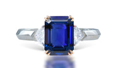 12 custom made unique emerald cut blue sapphire center stone with trillion diamond accents three stone engagement ring