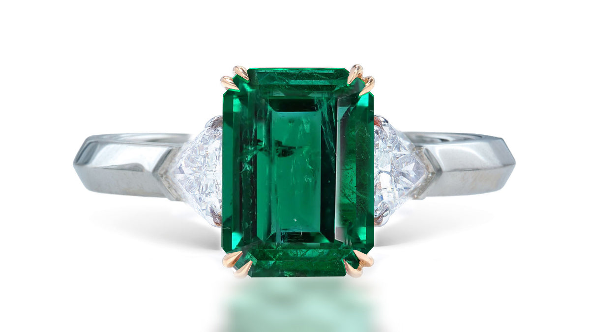 12 custom made unique emerald cut emerald center stone with trillion diamond accents three stone engagement ring