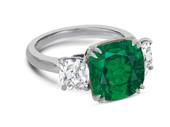 120 custom made unique cushion cut emerald center stone and cushion cut diamond side three stone engagement ring