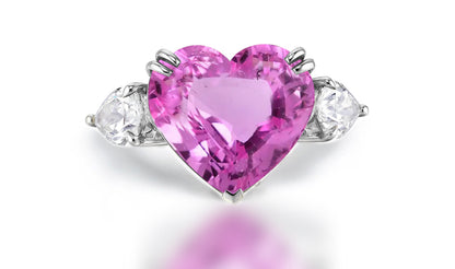 Custom made pink sapphire and diamond three stone engagement rings