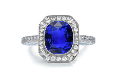 1203 custom made vintage inspired blue sapphire and diamond floral halo engagement rings