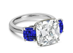 121 custom made unique cushion cut diamond center stone and cushion cut blue sapphire side three stone engagement ring