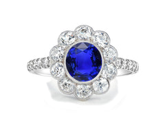 1210 custom made vintage inspired blue sapphire and diamond floral halo engagement rings