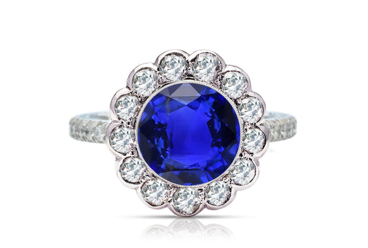 1214 custom made vintage inspired blue sapphire and diamond floral halo engagement rings