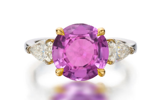 122 custom made unique round cut pink sapphire center stone and pear cut diamond side three stone engagement ring