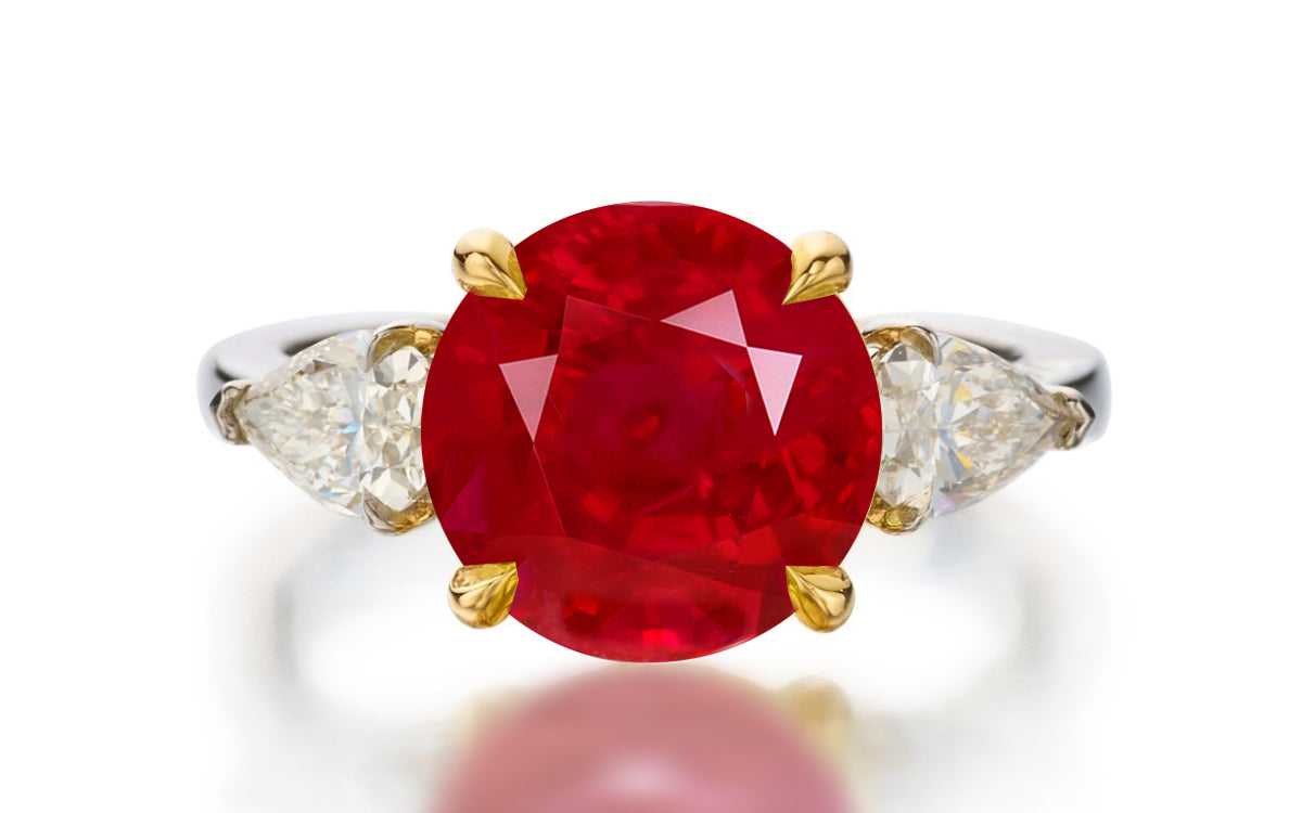 122 custom made unique round cut ruby center stone and pear cut diamond side three stone engagement ring