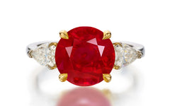 122 custom made unique round cut ruby center stone and pear cut diamond side three stone engagement ring