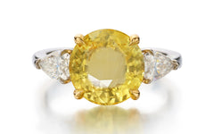 122 custom made unique round cut yellow sapphire center stone and pear cut diamond side three stone engagement ring