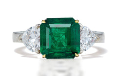 125 custom made unique asscher cut emerald center stone and heart diamond side three stone engagement ring