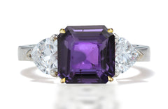 125 custom made unique asscher cut purple sapphire center stone and heart diamond side three stone engagement ring