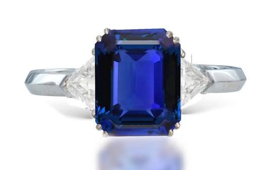 13 custom made unique emerald cut blue sapphire center stone with trillion diamond accents three stone engagement ring