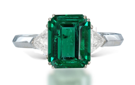 13 custom made unique emerald cut emerald center stone with trillion diamond accents three stone engagement ring