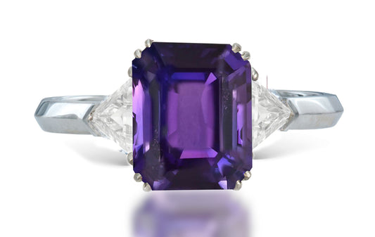 13 custom made unique emerald cut purple sapphire center stone with trillion diamond accents three stone engagement ring