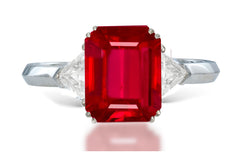 13 custom made unique emerald cut ruby center stone with trillion diamond accents three stone engagement ring