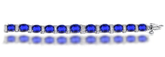 13 custom unique alternating oval blue sapphire and diamond halo tennis bracelet