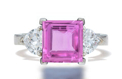 132 custom made unique square pink sapphire center stone and heart diamond side three stone engagement ring