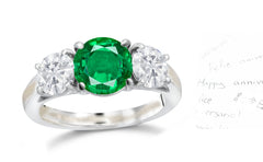 135 custom made unique round emerald center stone and round diamond side three stone engagement ring