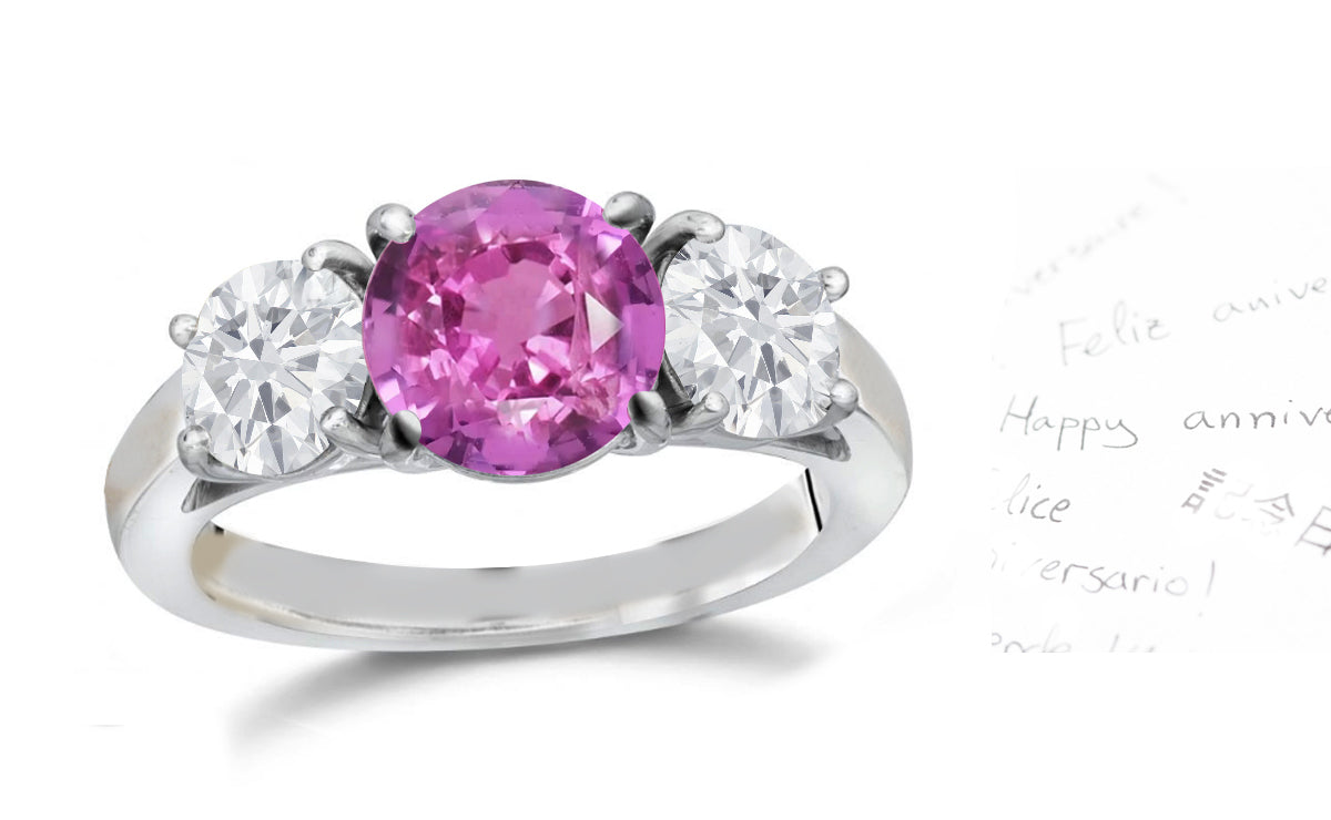 135 custom made unique round pink sapphire center stone and round diamond side three stone engagement ring