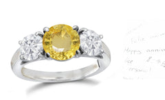 135 custom made unique round yellow sapphire center stone and round diamond side three stone engagement ring