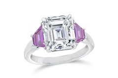 139 custom made unique emerald cut diamond center stone and trapezoid pink sapphire side three stone engagement ring