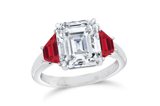 139 custom made unique emerald cut diamond center stone and trapezoid ruby side three stone engagement ring