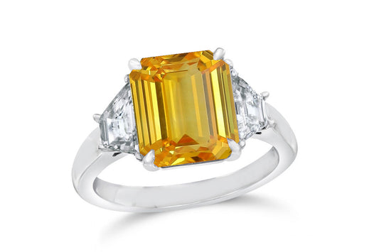 139 custom made unique emerald cut yellow sapphire center stone and trapezoid diamond side three stone engagement ring