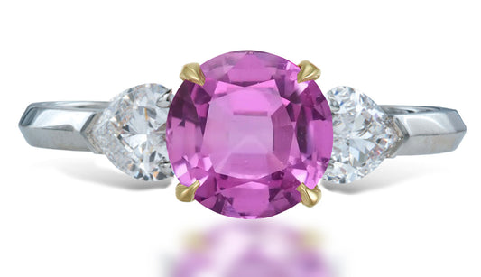 14 custom made unique round pink sapphire center stone with heart diamond accents three stone engagement ring