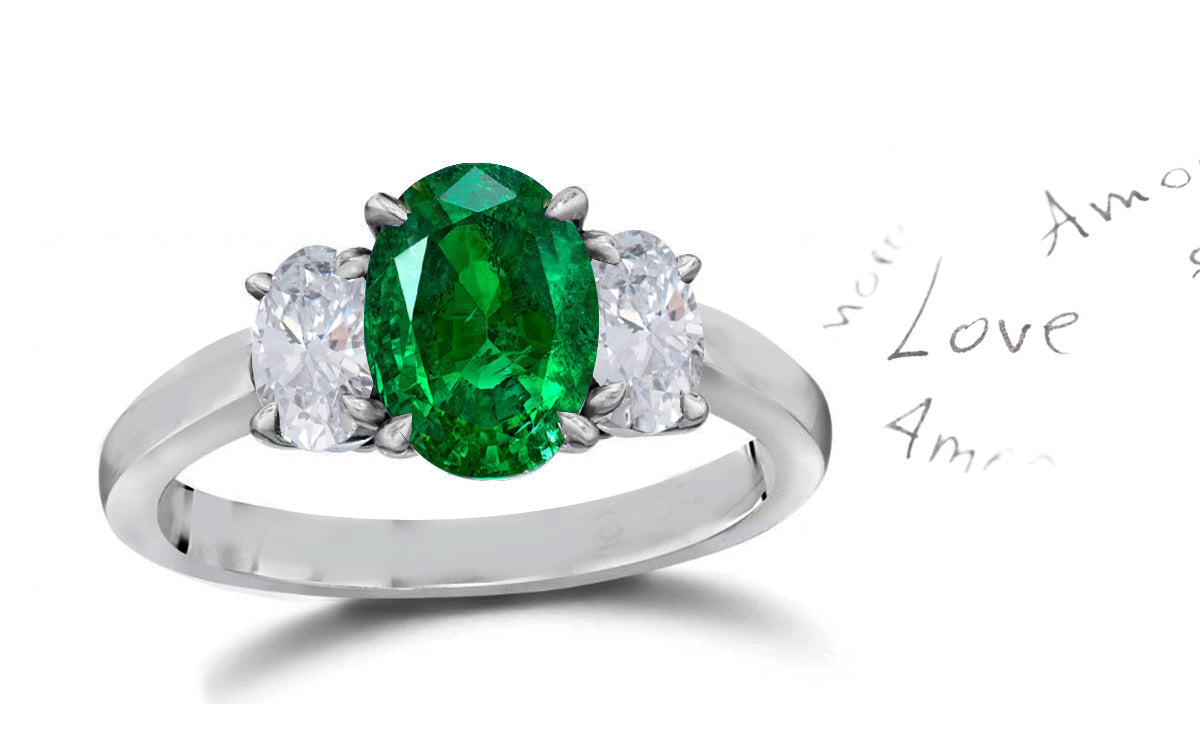 140 custom made unique oval emerald center stone and oval diamond side three stone engagement ring