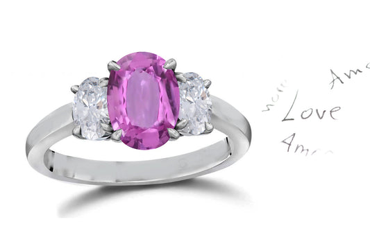 140 custom made unique oval pink sapphire center stone and oval diamond side three stone engagement ring