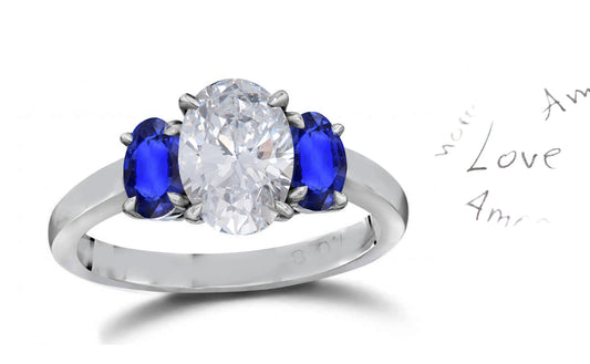 141 custom made unique oval diamond center stone and oval blue sapphire side three stone engagement ring