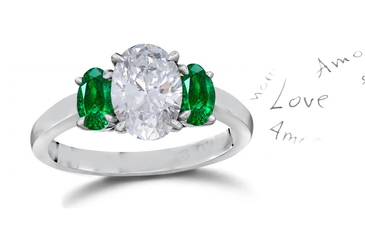 141 custom made unique oval diamond center stone and oval emerald side three stone engagement ring