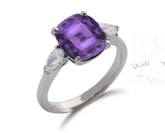 153 custom made unique cushion cut purple sapphire center stone and pear diamond accents three stone engagement ring