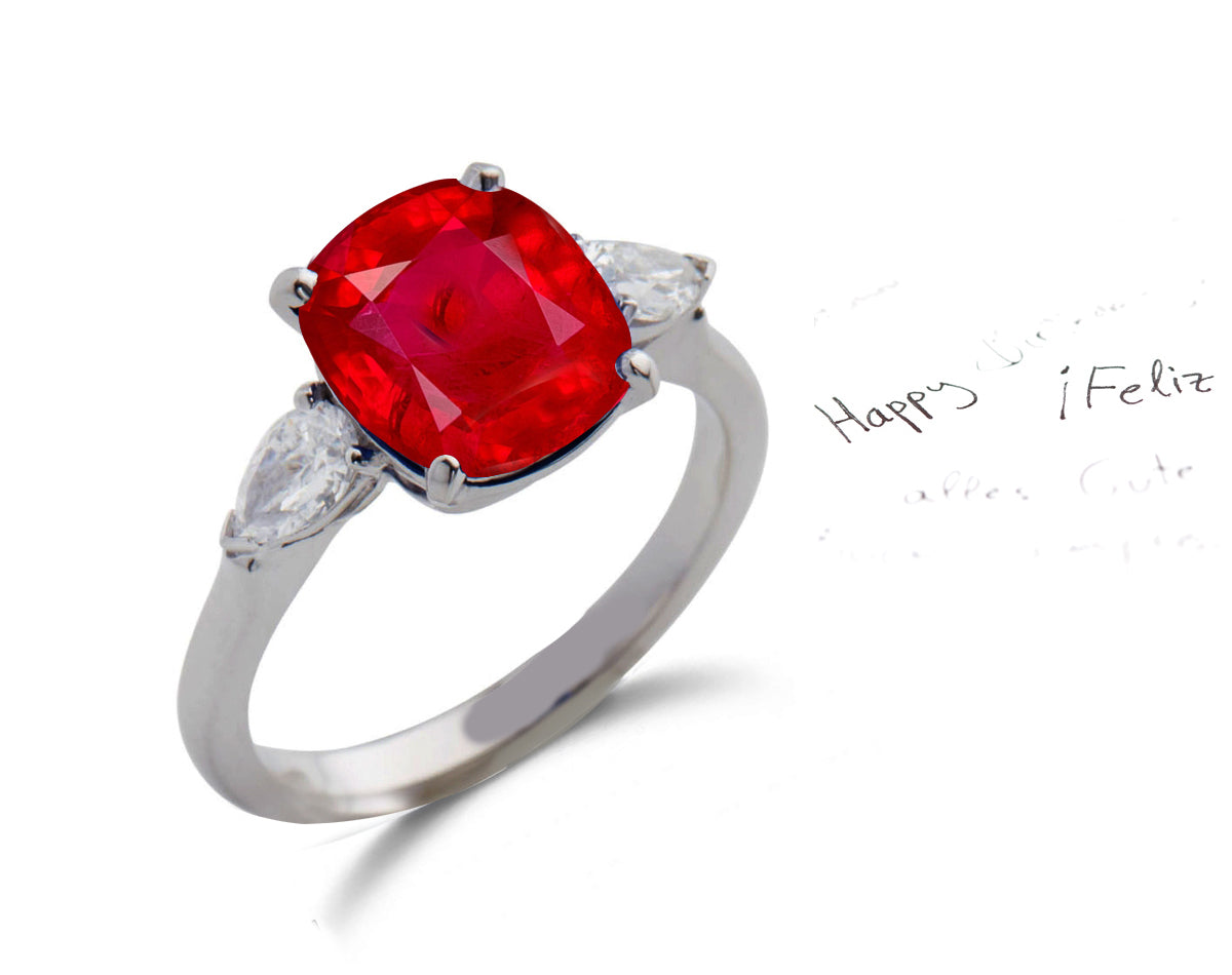 153 custom made unique cushion cut ruby center stone and pear diamond accents three stone engagement ring