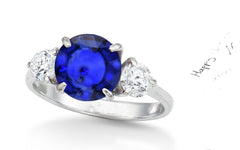 154 custom made unique round blue sapphire center stone and round diamond accents three stone engagement ring