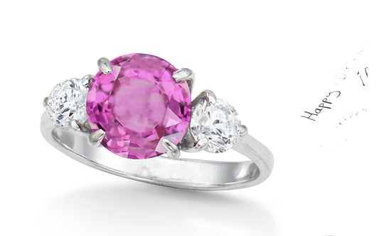 154 custom made unique round pink sapphire center stone and round diamond accents three stone engagement ring