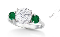 155 custom made unique round diamond center stone and emerald diamond accents three stone engagement ring