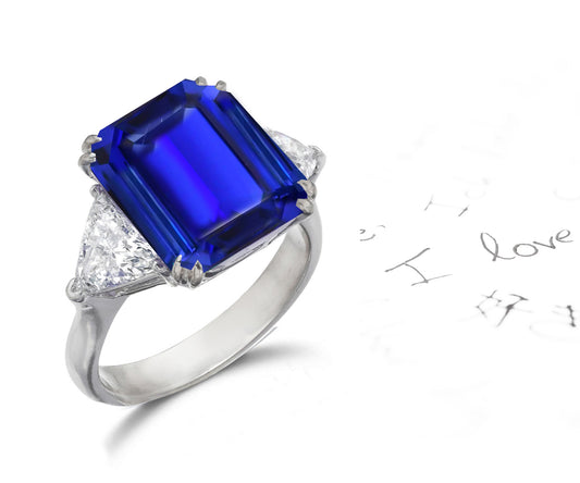 158 custom made unique emerald cut blue sapphire center stone and trillion cut diamond accents three stone engagement ring