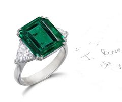 158 custom made unique emerald cut emerald center stone and trillion cut diamond accents three stone engagement ring